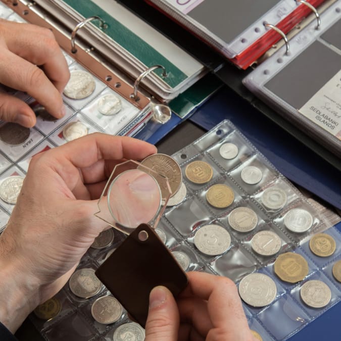 inspecting coin collection