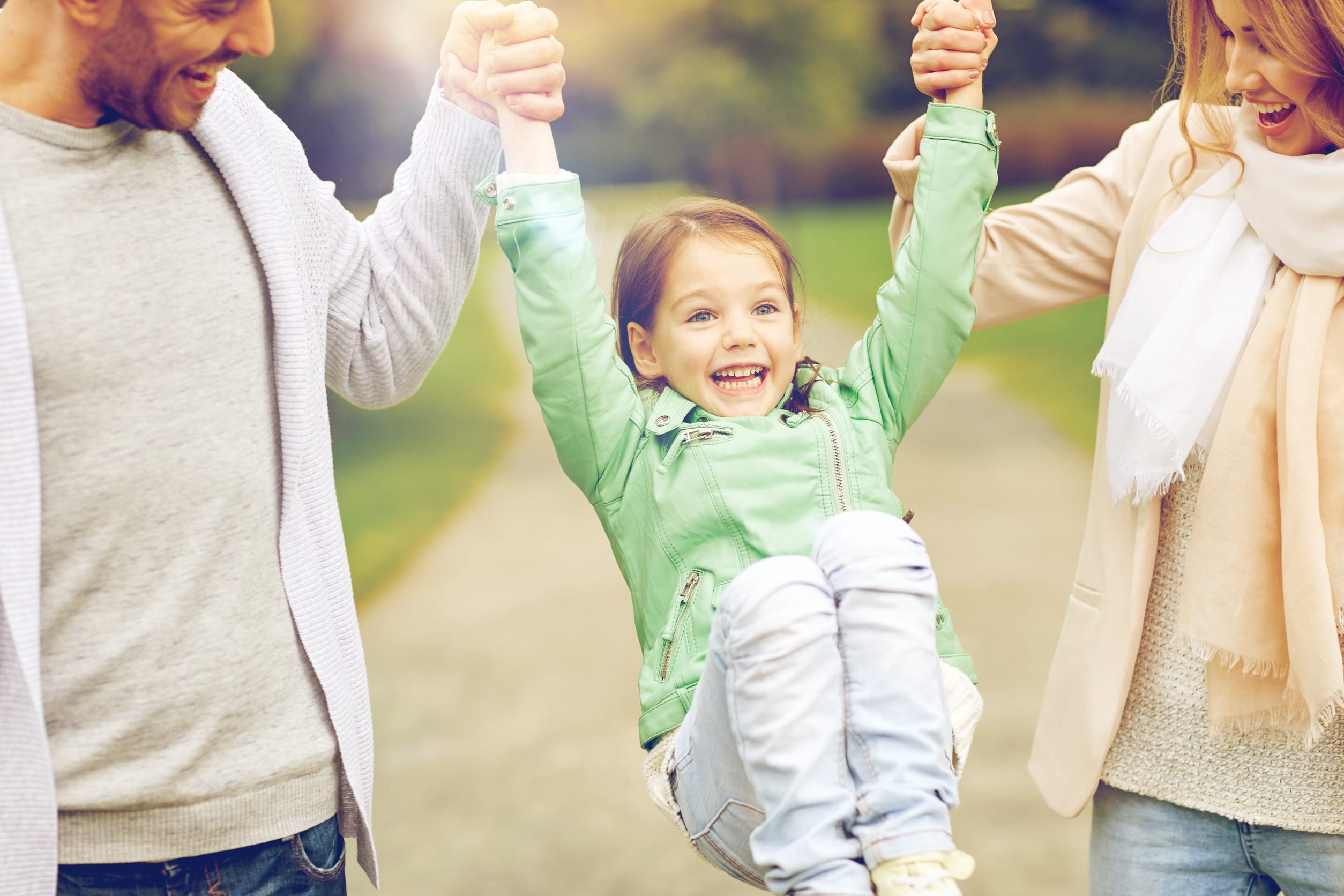 parents and daughter at the park