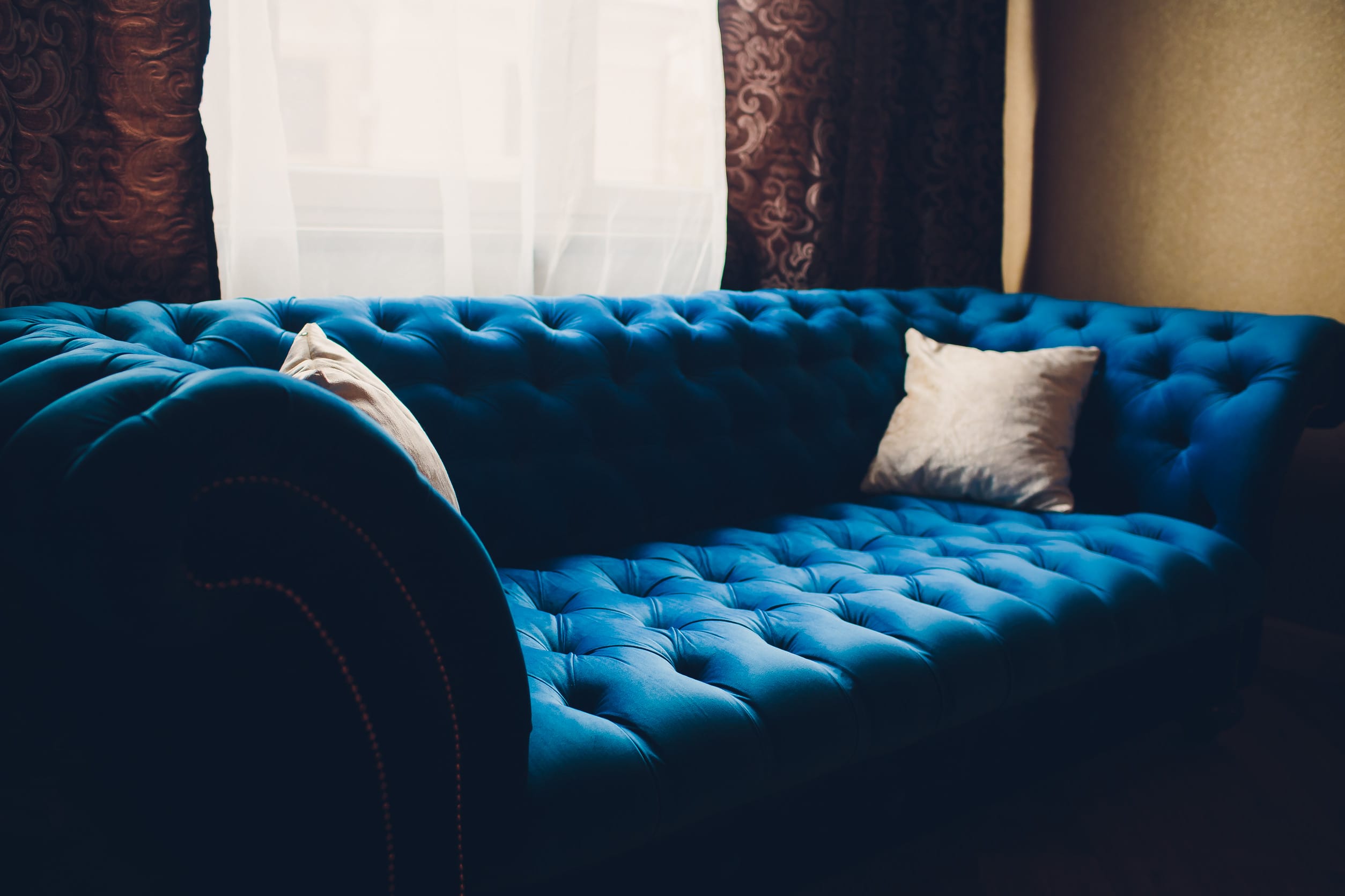 Pretty simple decor of living room with blue sofa and light