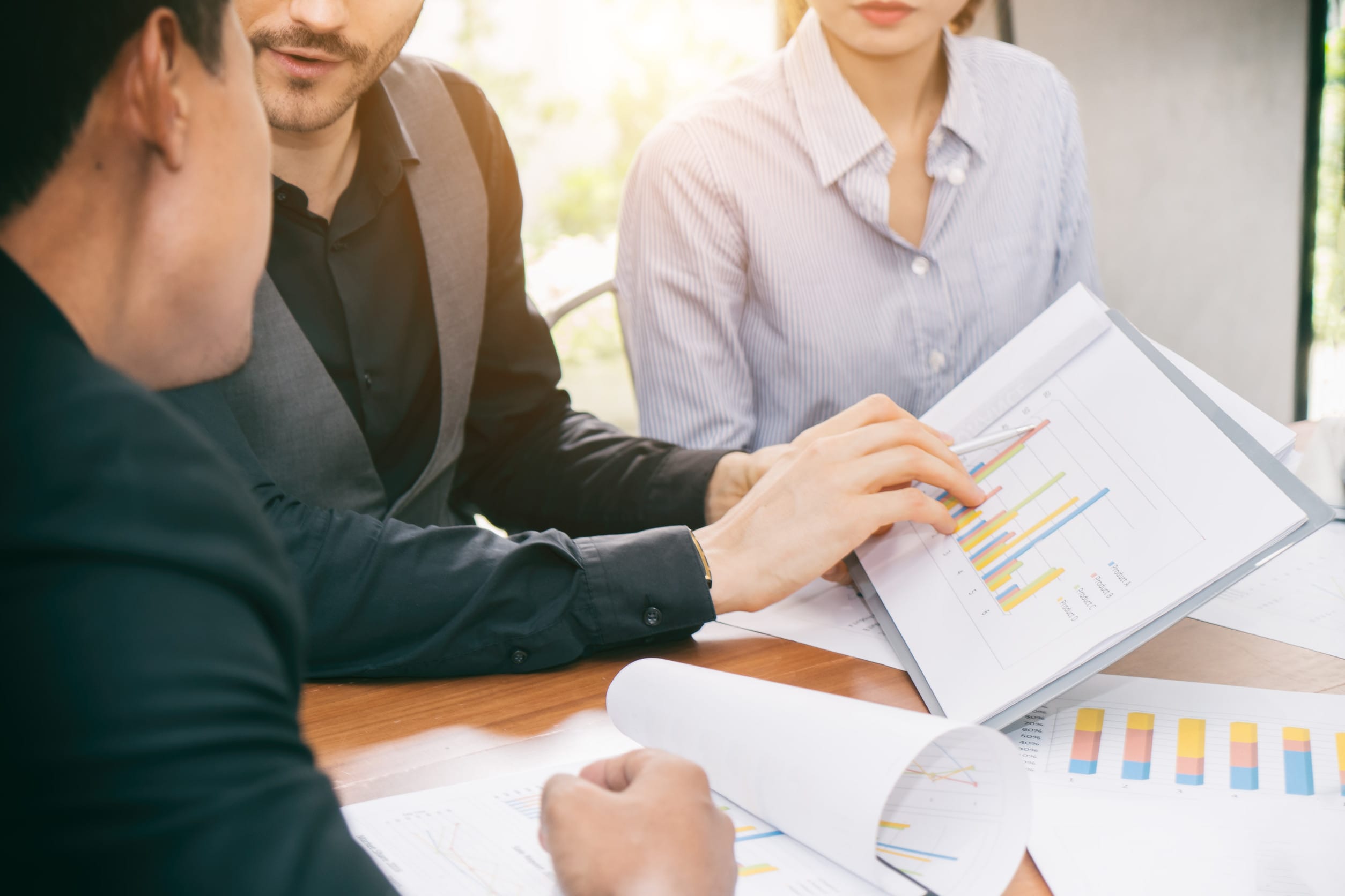 Smart manager explaining internal meeting to his project team in modern office. The multi ethnic business person group in suit. Project and Business concept.