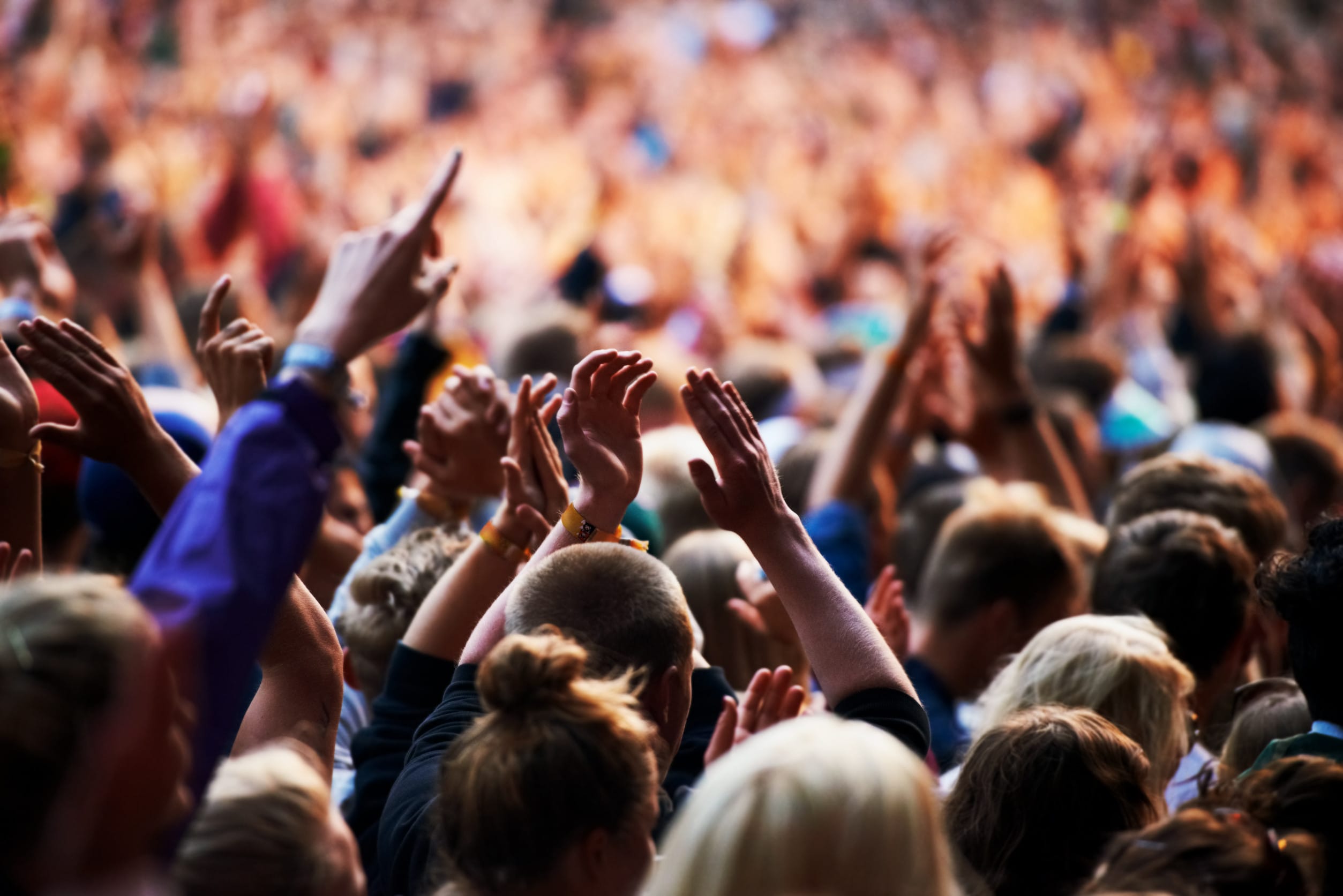 Shot of a crowd of young people at an outdoor music festival.