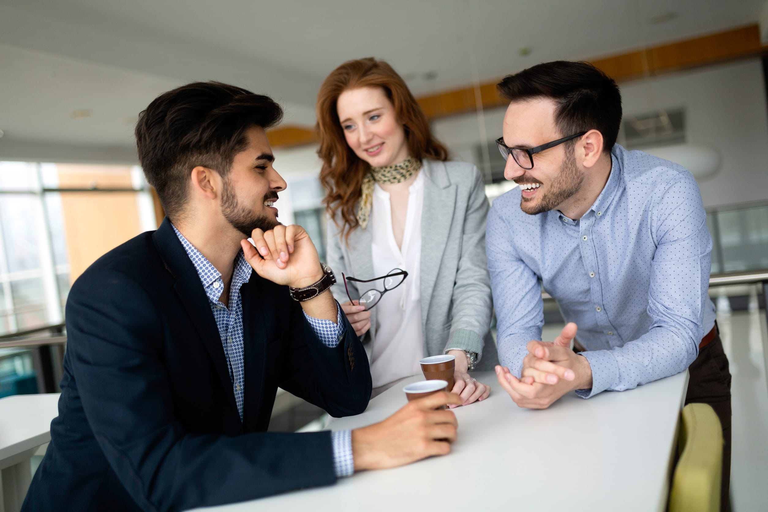 Business people having fun and chatting at workplace office