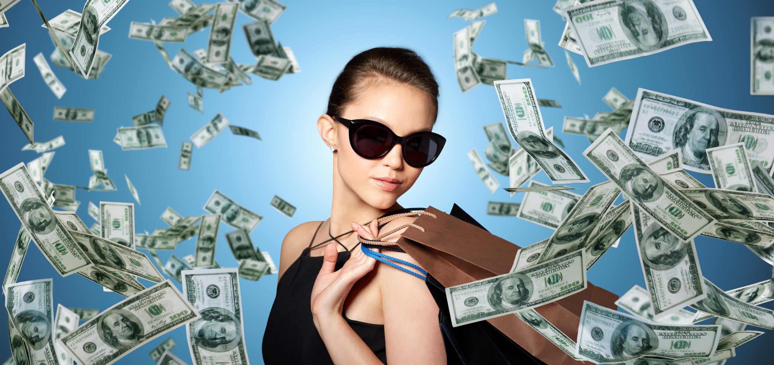 Woman with money all around her