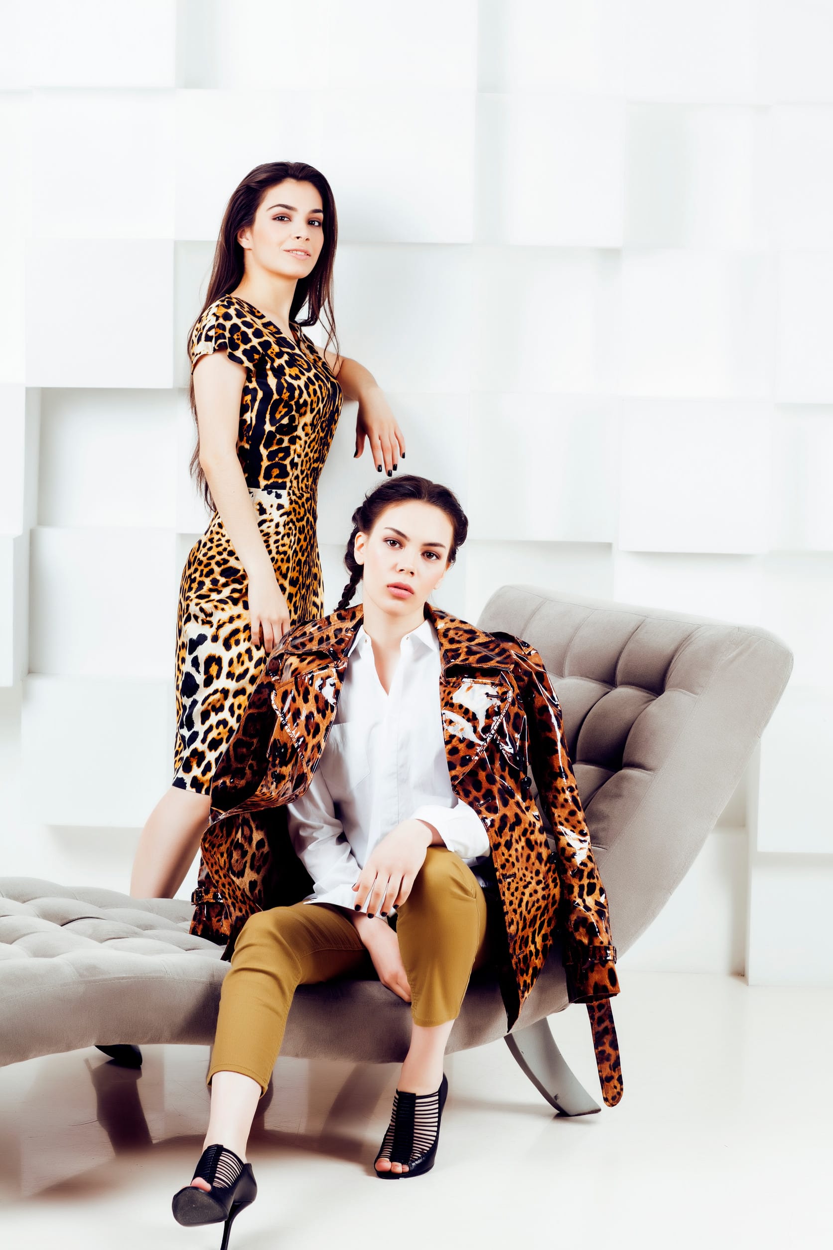 pretty stylish woman in fashion dress with leopard print together in luxury rich room interior, lifestyle people concept, modern brunette together close up