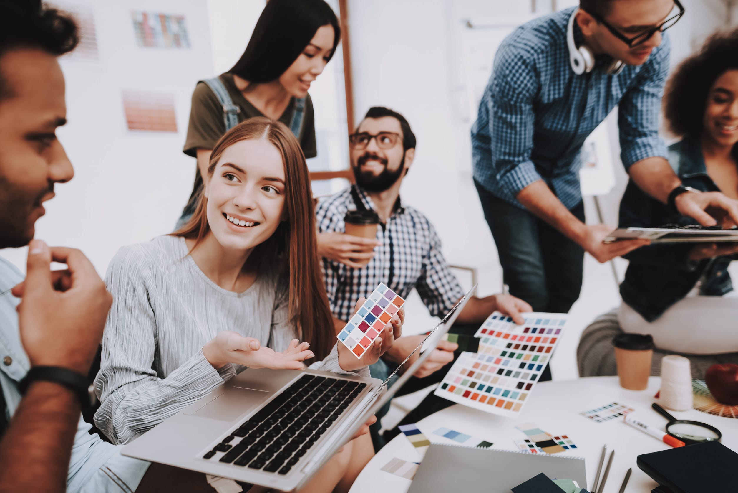 Design Studio. Look. Young People. Different Nationalities. Designers. Young Specialists. Choose Colors for Design. Teamwork. Discussion. Brainstorming. Multi-Ethnic. Project. Creative. Workplace.