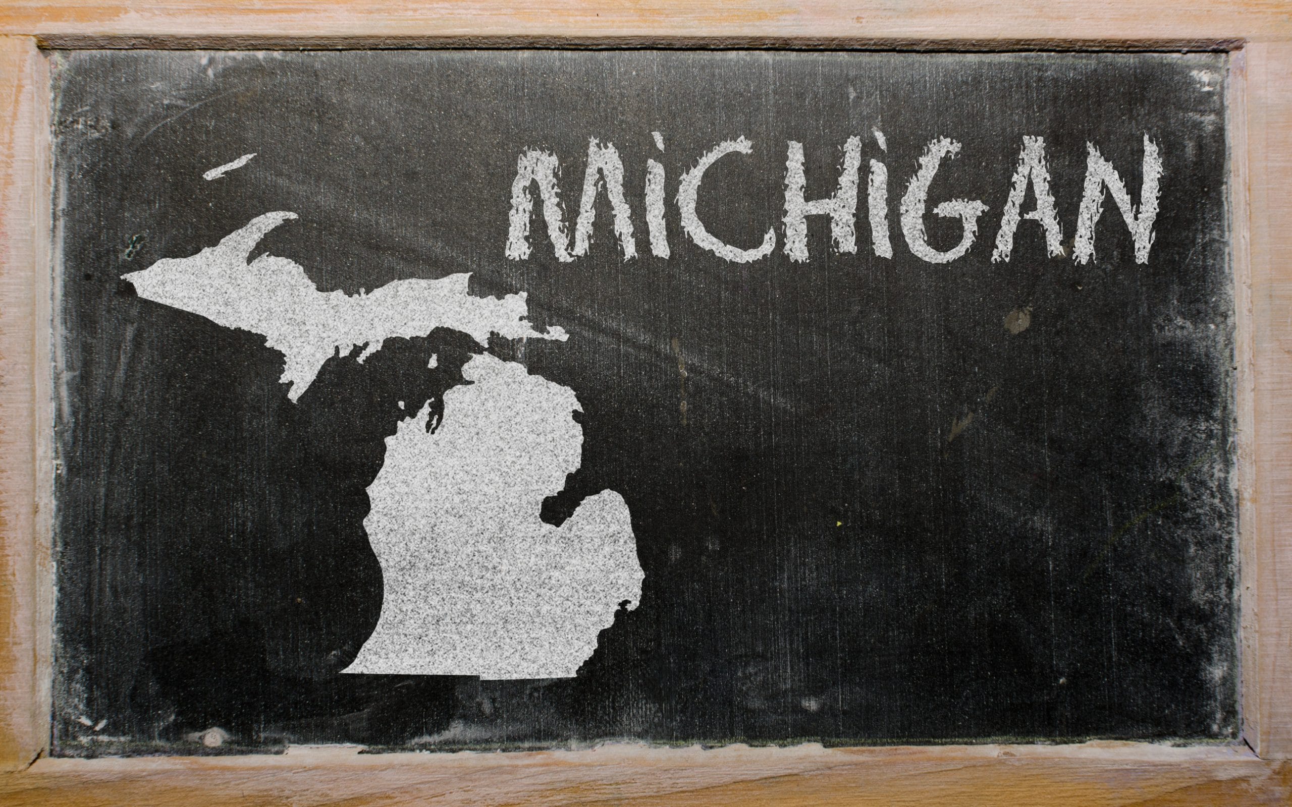 drawing of american state of michigan on chalkboard, drawn by chalk