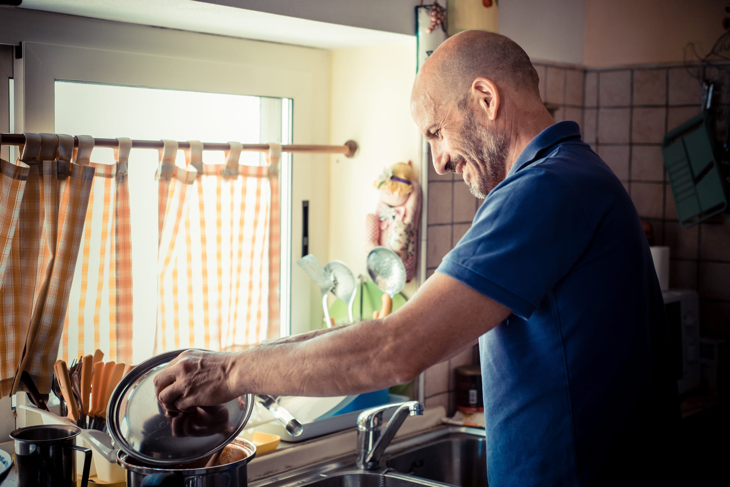 middle age man cooking at home
